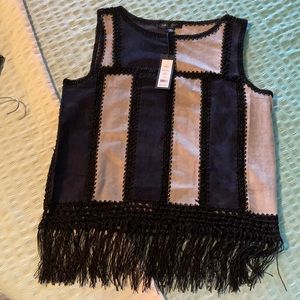 Very cute suede sleeveless top with fringe hem.